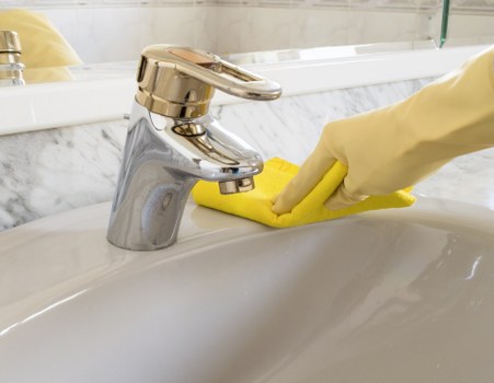 Technician treating stains on a mattress during a cleaning appointment in Marylebone